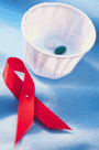 HIV/AIDS awareness ribbon and two pills